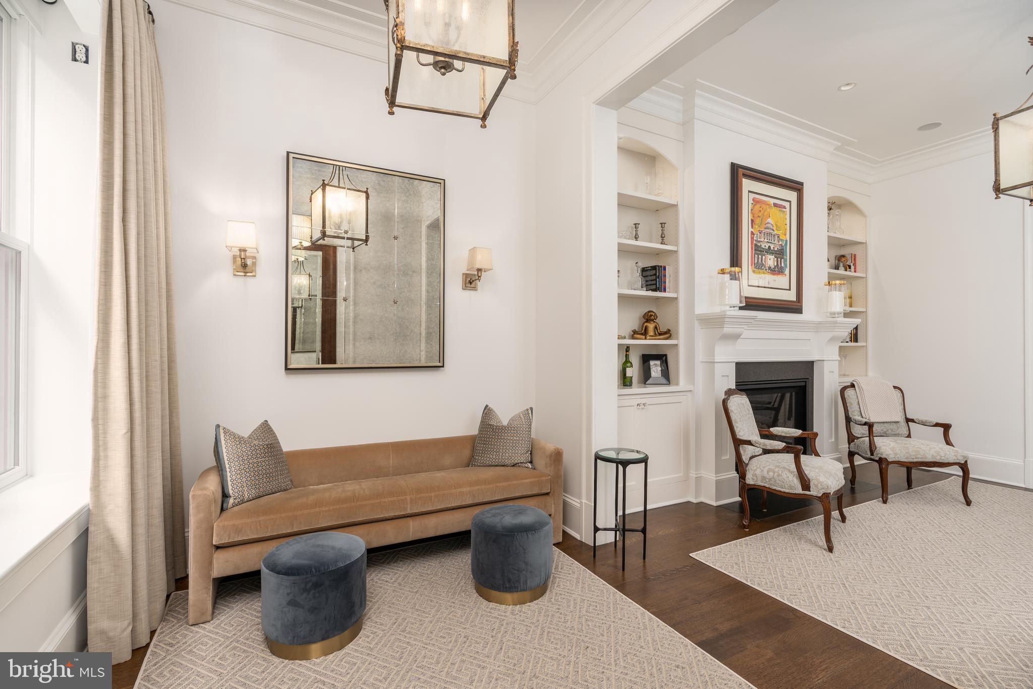 1619 19th Street Northwest Washington, DC 20009 - Photo 5 of 50 a living room with furniture a fireplace and next to a window