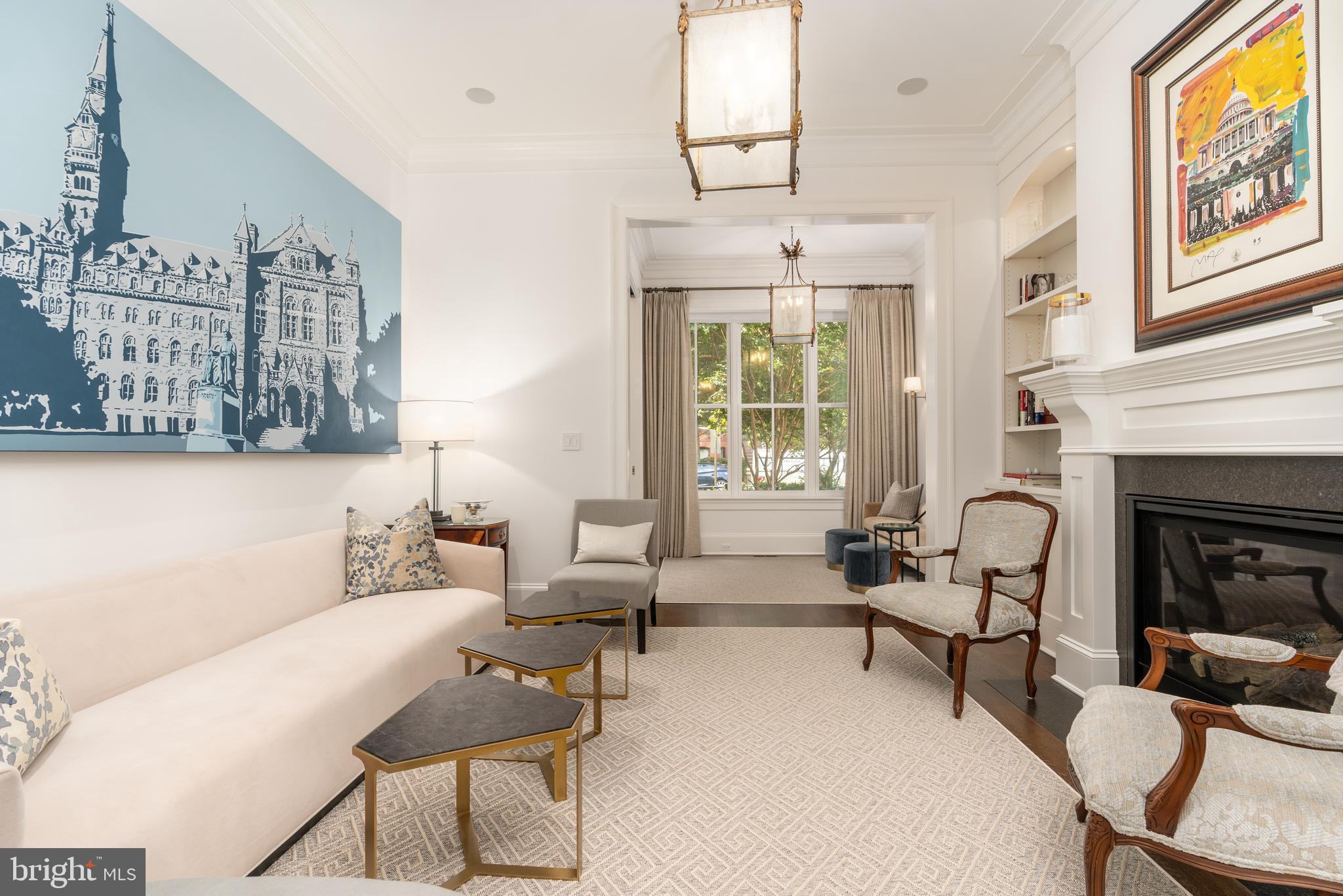 1619 19th Street Northwest Washington, DC 20009 - Photo 6 of 50 a living room with furniture windows and a fireplace