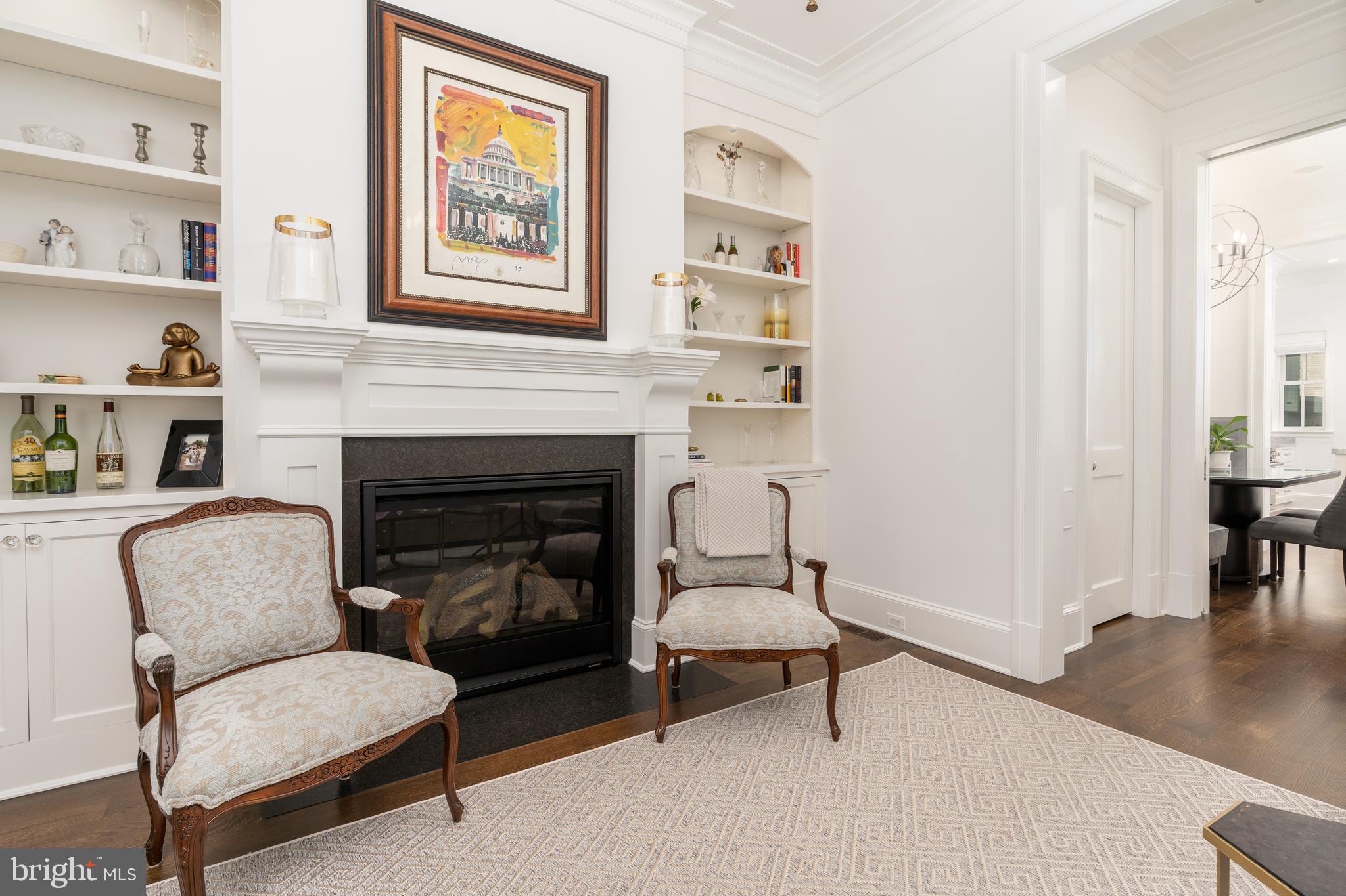 1619 19th Street Northwest Washington, DC 20009 - Photo 7 of 50 a living room with furniture and a fireplace