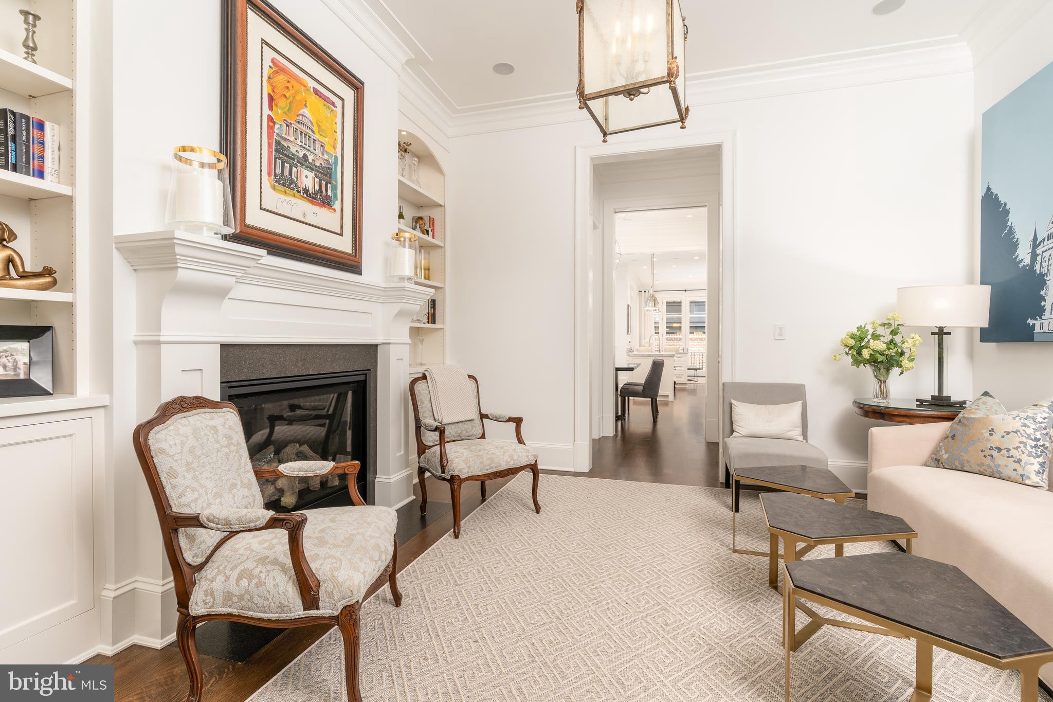 1619 19th Street Northwest Washington, DC 20009 - Photo 8 of 50 a living room with furniture and a fireplace