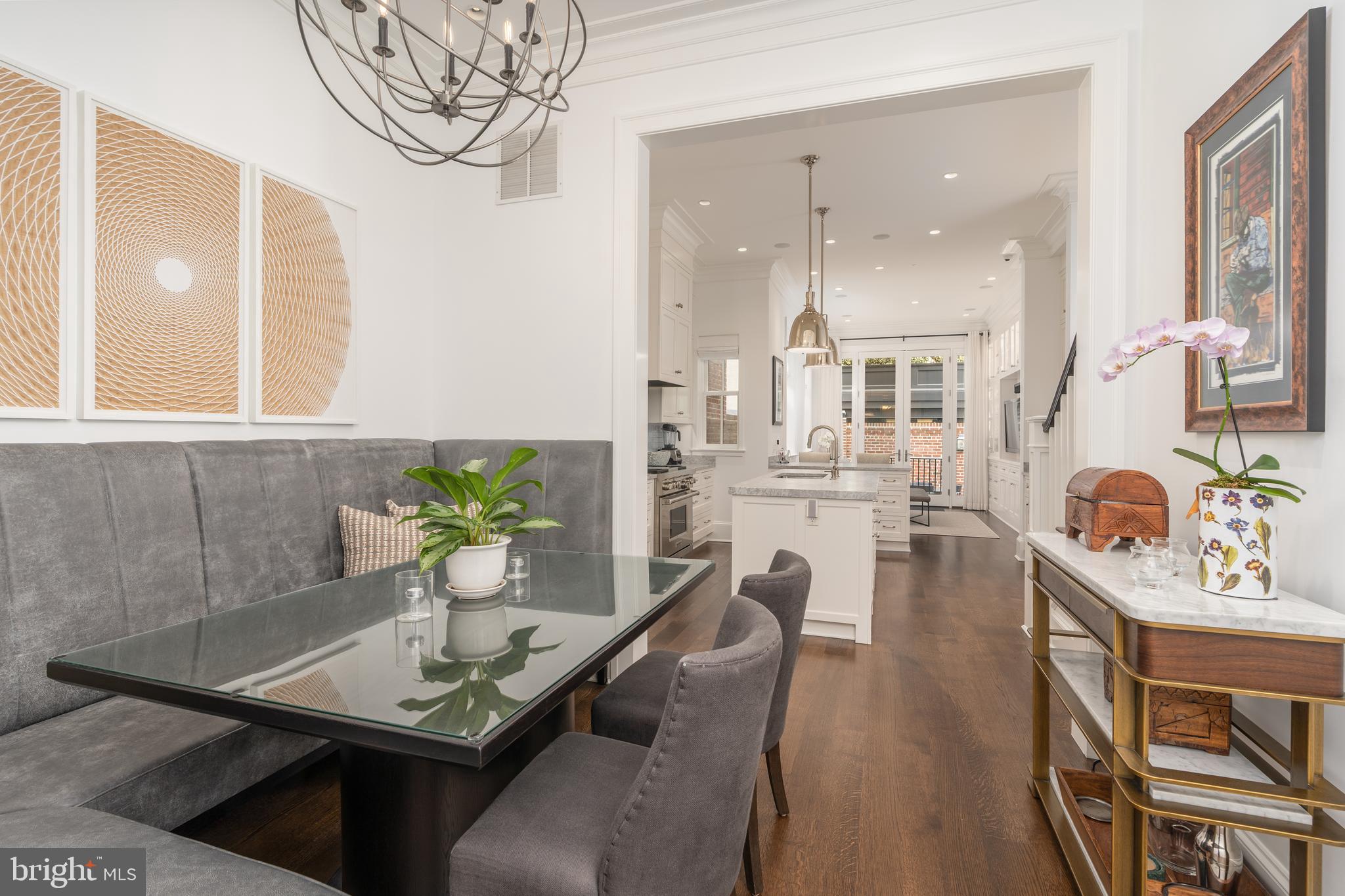 1619 19th Street Northwest Washington, DC 20009 - Photo 9 of 50 a view of a dining room with furniture and a chandelier