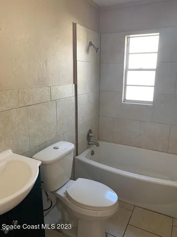 a bathroom with a toilet a sink and a bathtub