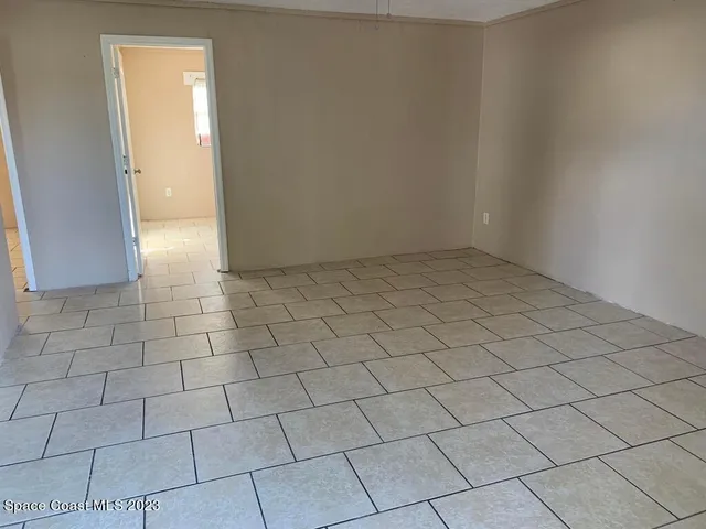 a view of a livingroom and entryway