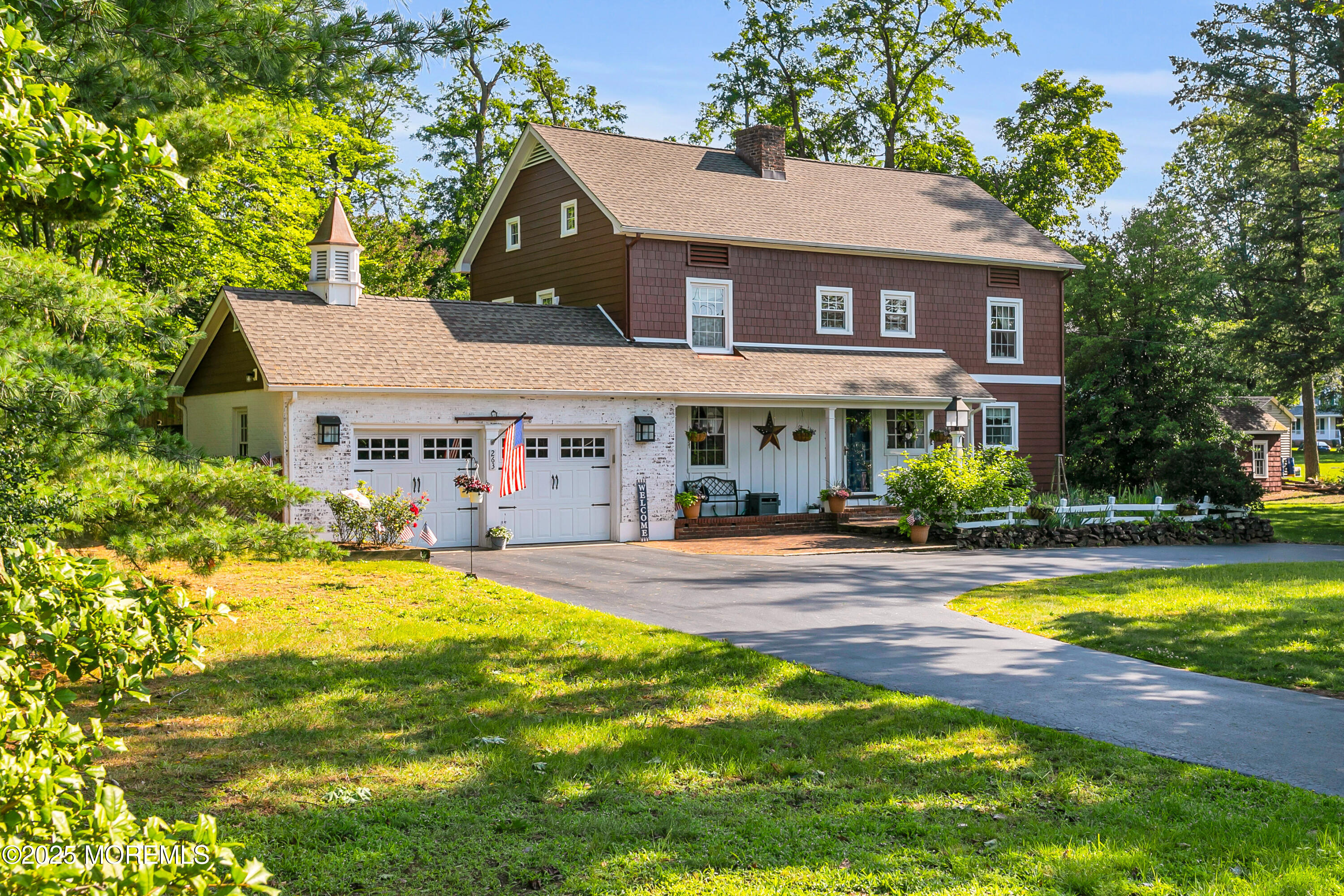263 Cooper Road Red Bank, NJ 07701 - Photo 1 of 42 a view of a house with swimming pool and sitting area