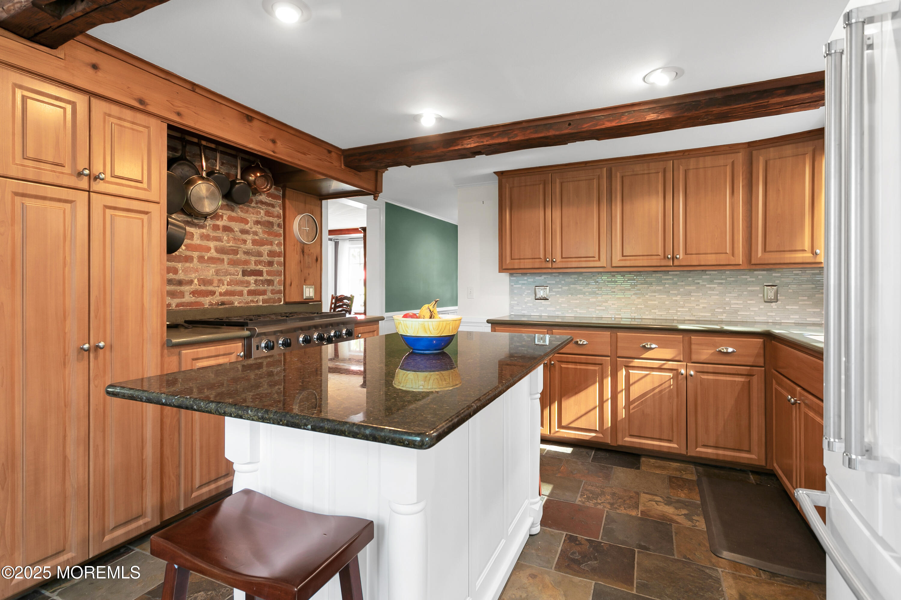 263 Cooper Road Red Bank, NJ 07701 - Photo 11 of 42 a kitchen with stainless steel appliances granite countertop a sink stove and cabinets