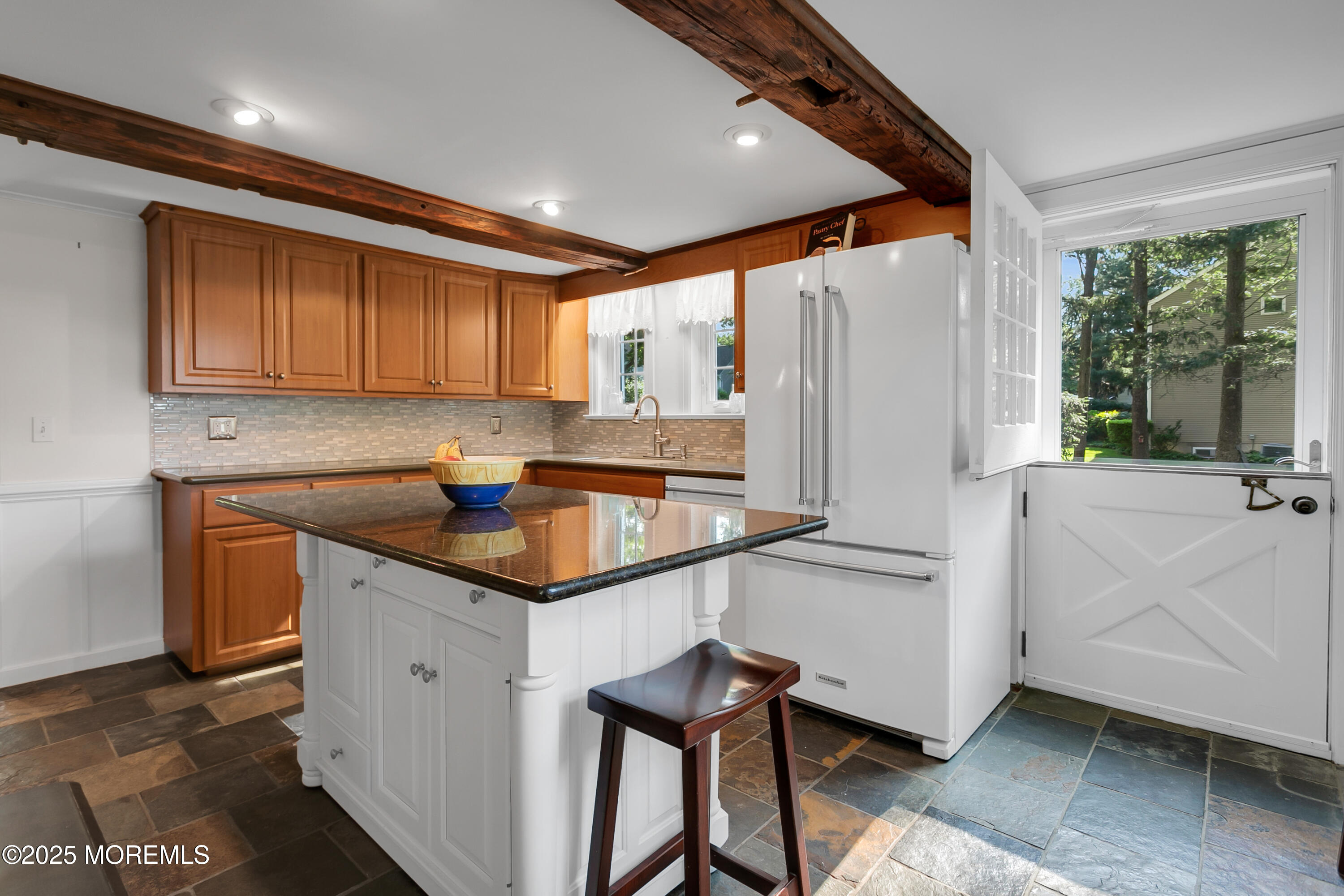 263 Cooper Road Red Bank, NJ 07701 - Photo 13 of 42 a kitchen with stainless steel appliances granite countertop a sink and a refrigerator