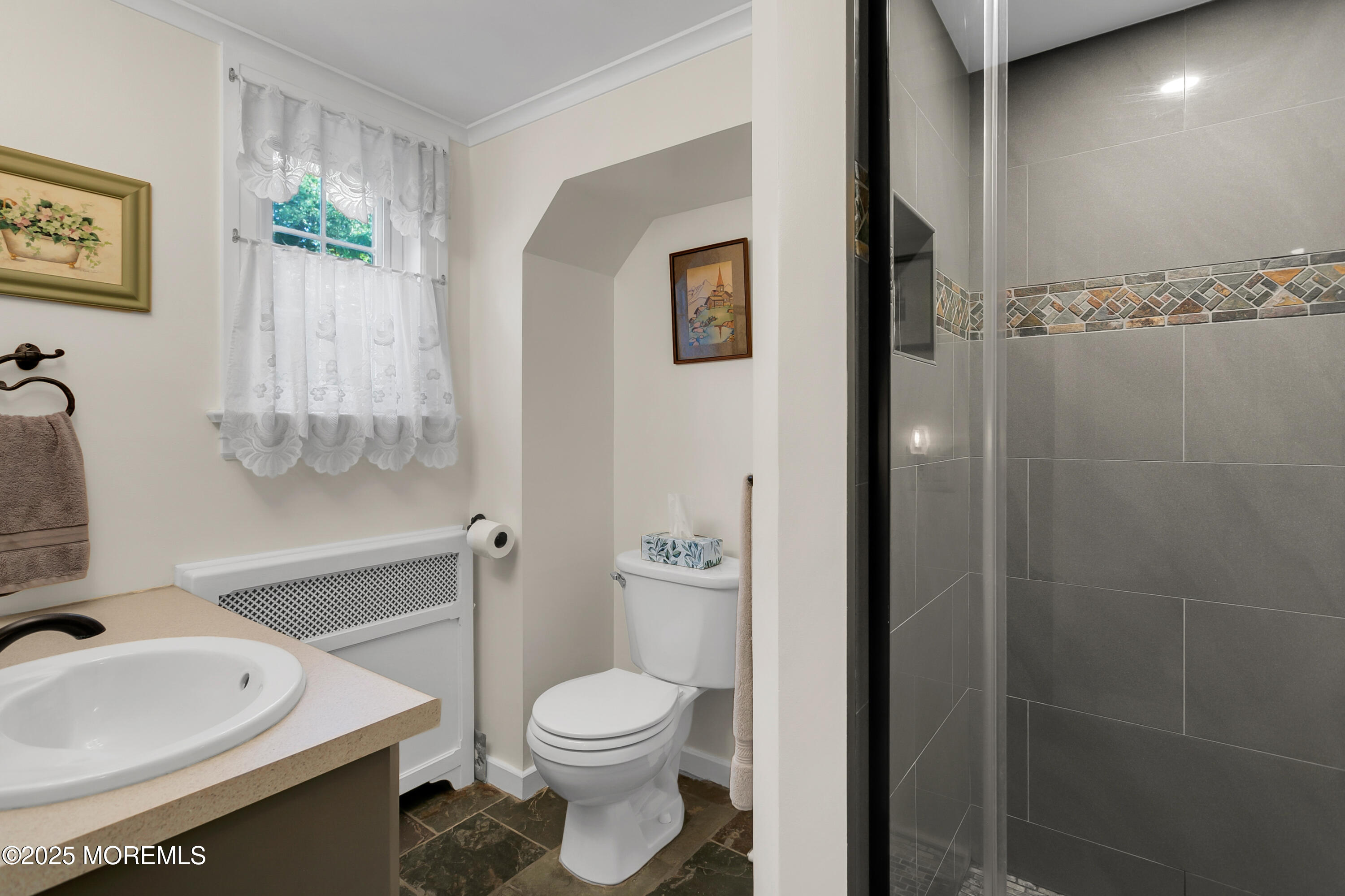 263 Cooper Road Red Bank, NJ 07701 - Photo 15 of 42 a bathroom with a toilet sink and shower