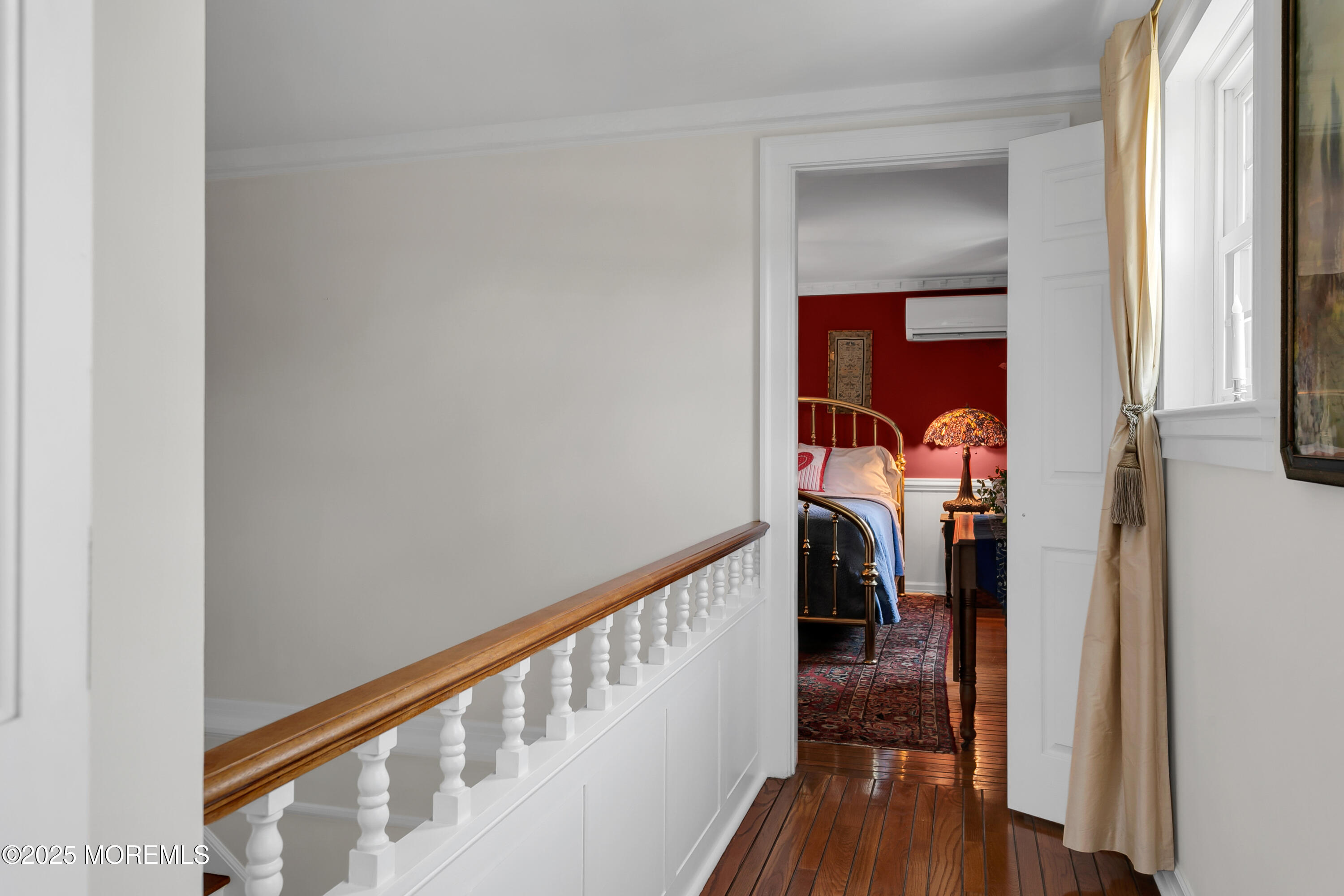 263 Cooper Road Red Bank, NJ 07701 - Photo 21 of 42 a hallway with wooden floor stairs