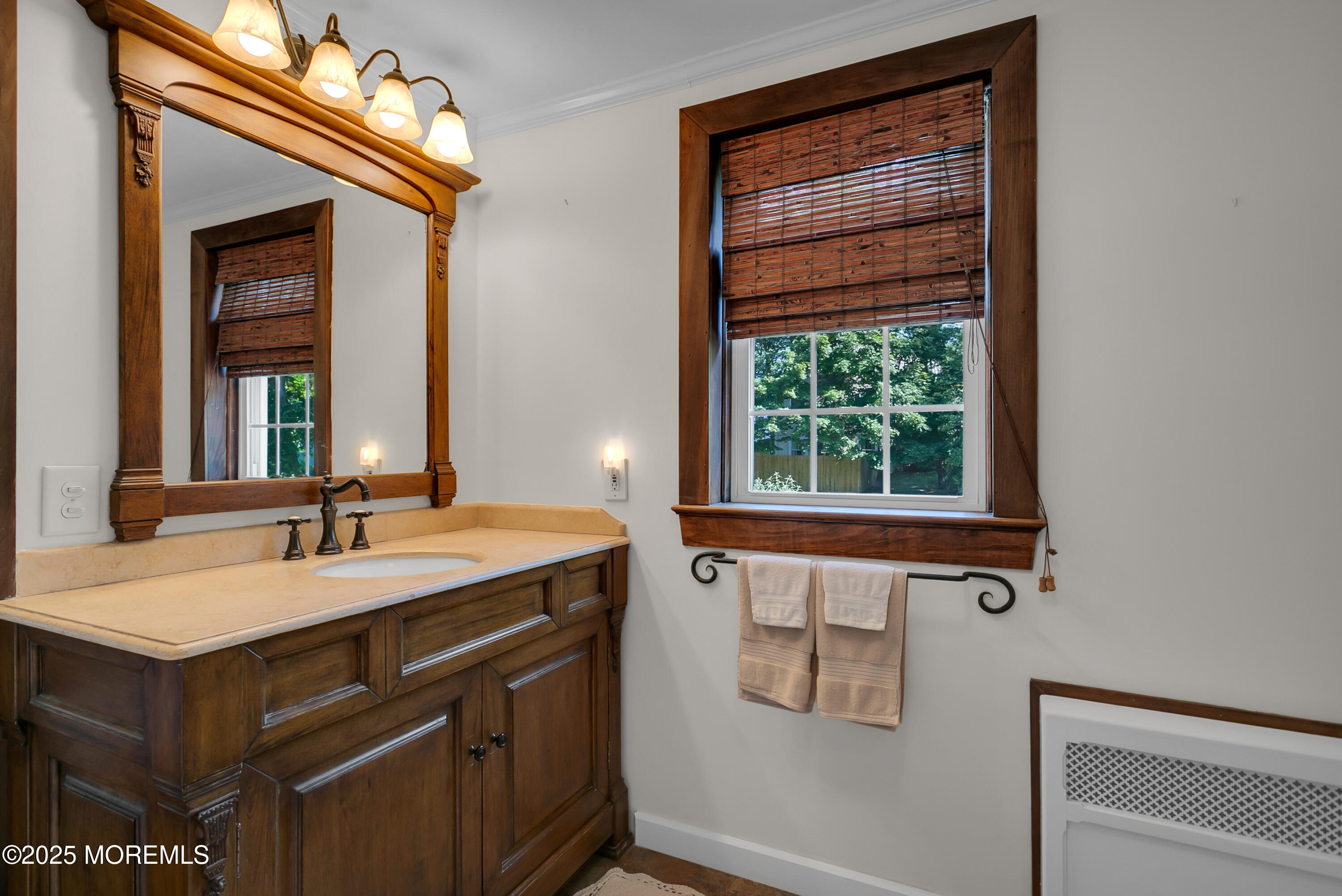 263 Cooper Road Red Bank, NJ 07701 - Photo 23 of 42 a bathroom with a sink and a mirror