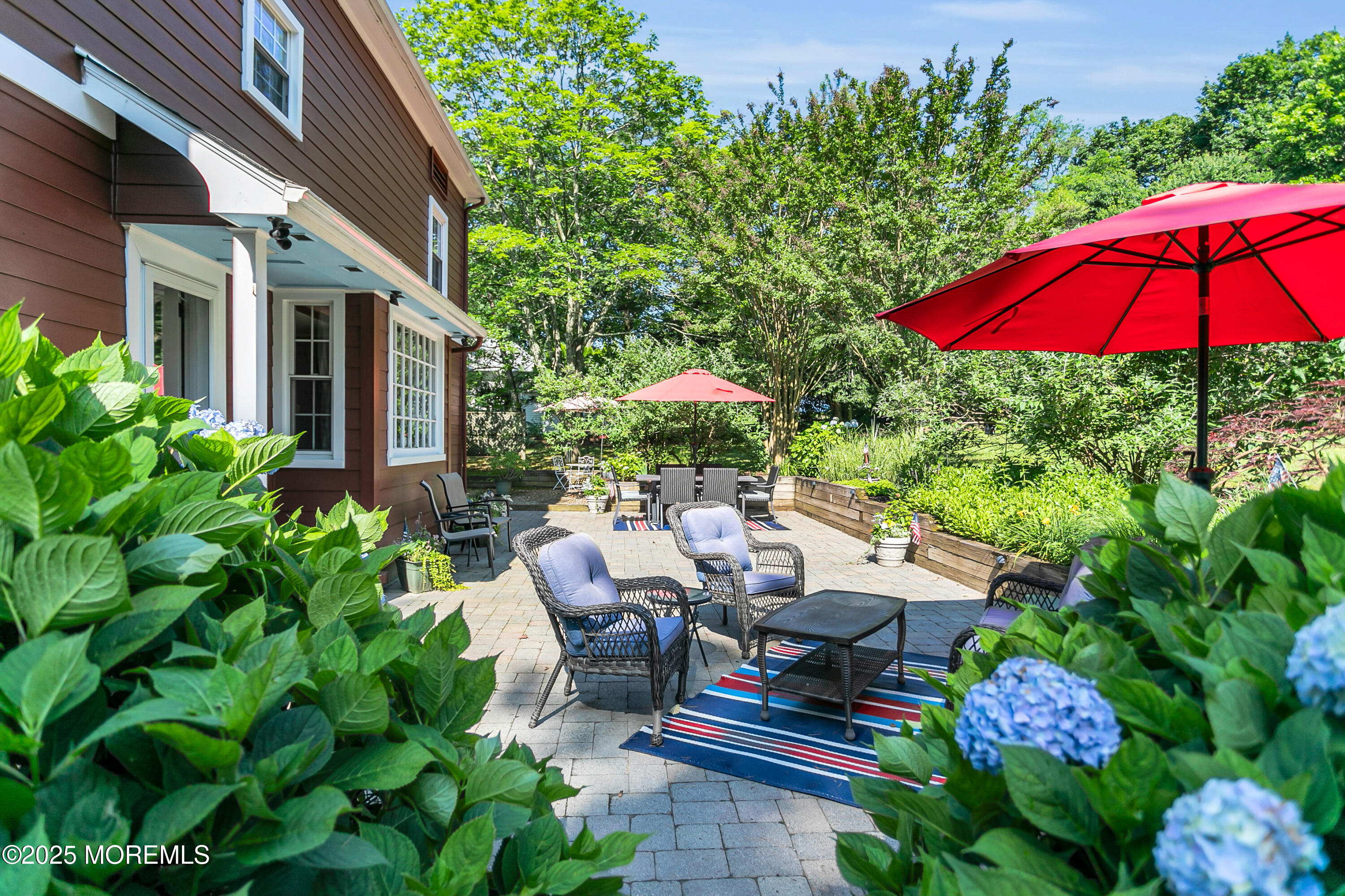 263 Cooper Road Red Bank, NJ 07701 - Photo 30 of 42 a view of a patio with chairs and table in the patio