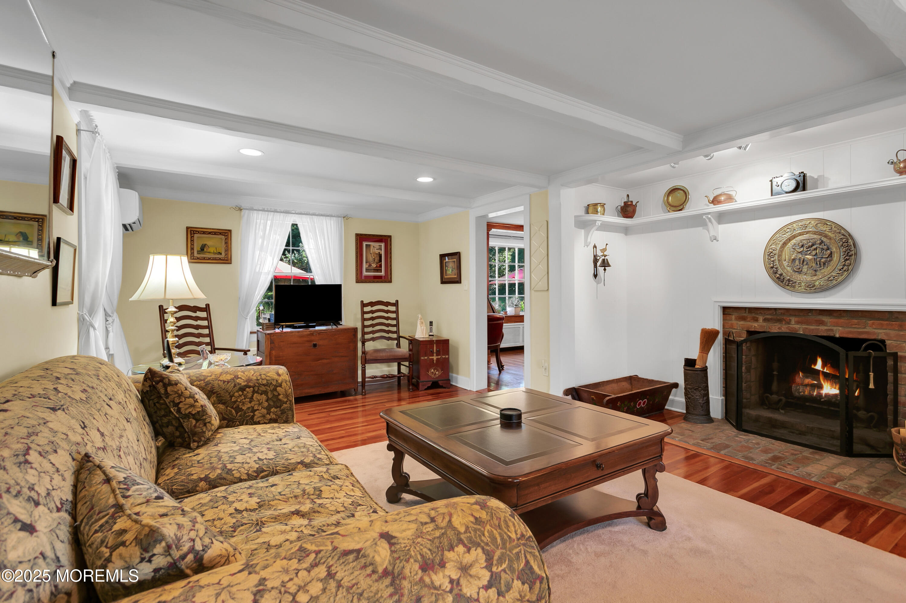 263 Cooper Road Red Bank, NJ 07701 - Photo 3 of 42 a living room with furniture and a fireplace