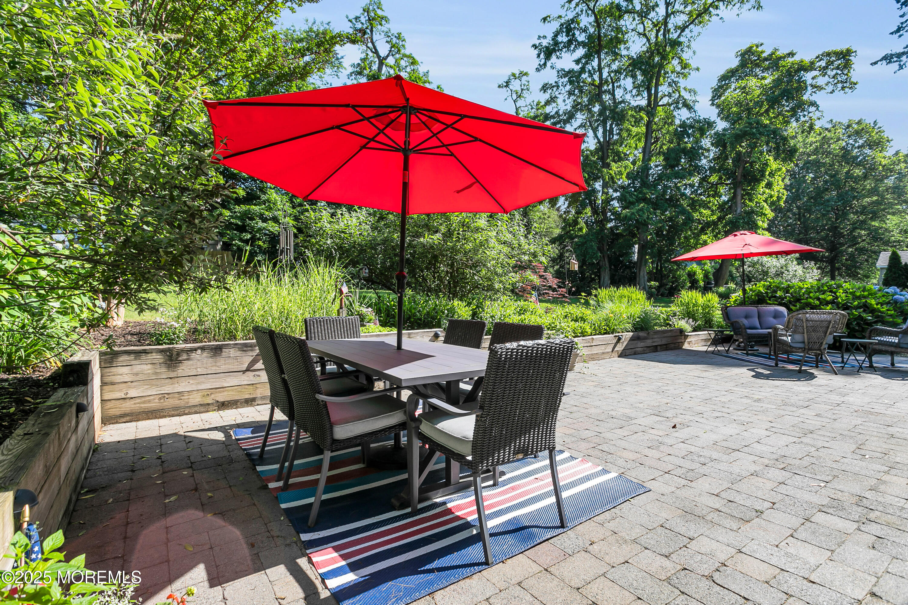263 Cooper Road Red Bank, NJ 07701 - Photo 32 of 42 an outdoor space with furniture and umbrella