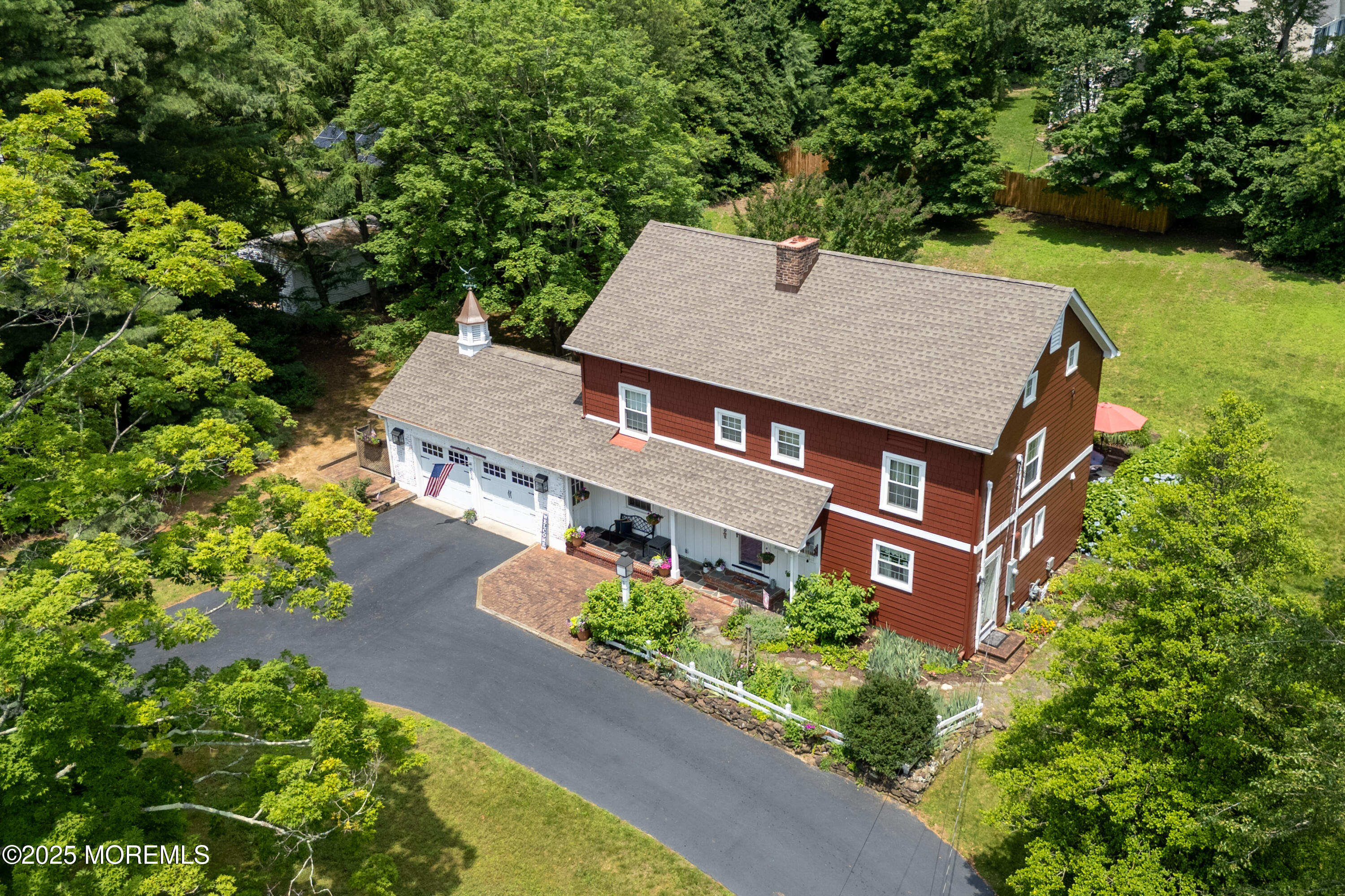 263 Cooper Road Red Bank, NJ 07701 - Photo 39 of 42 an aerial view of a house with a yard potted plants and large tree