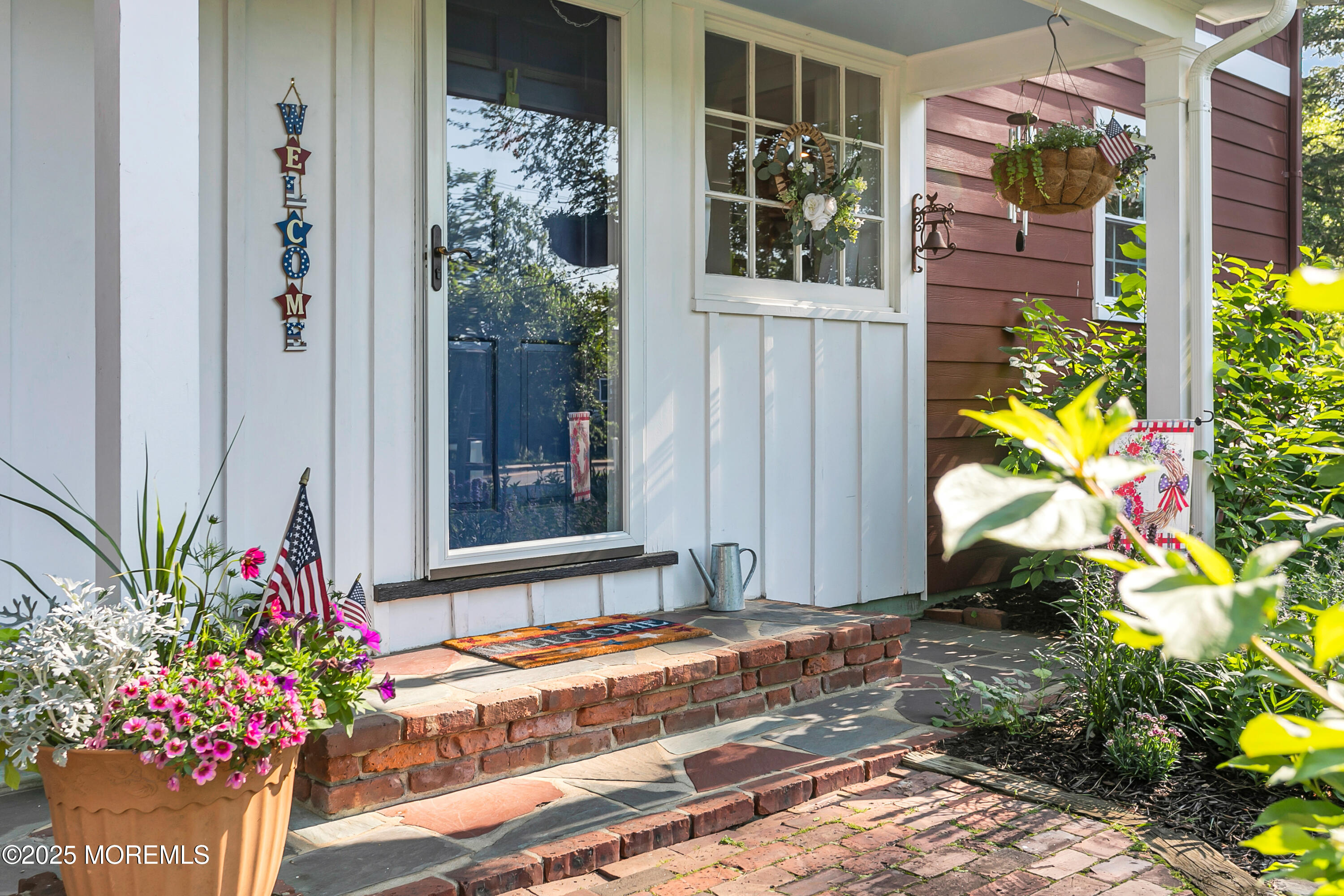 263 Cooper Road Red Bank, NJ 07701 - Photo 4 of 42 a potted plant sitting in front of a house