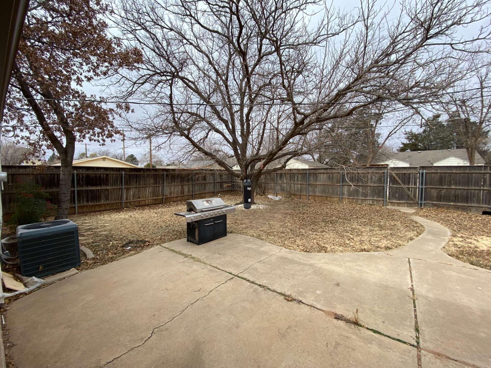 3214 32nd Street Lubbock, TX 79410 - Photo 15 of 17 a view of backyard with slide
