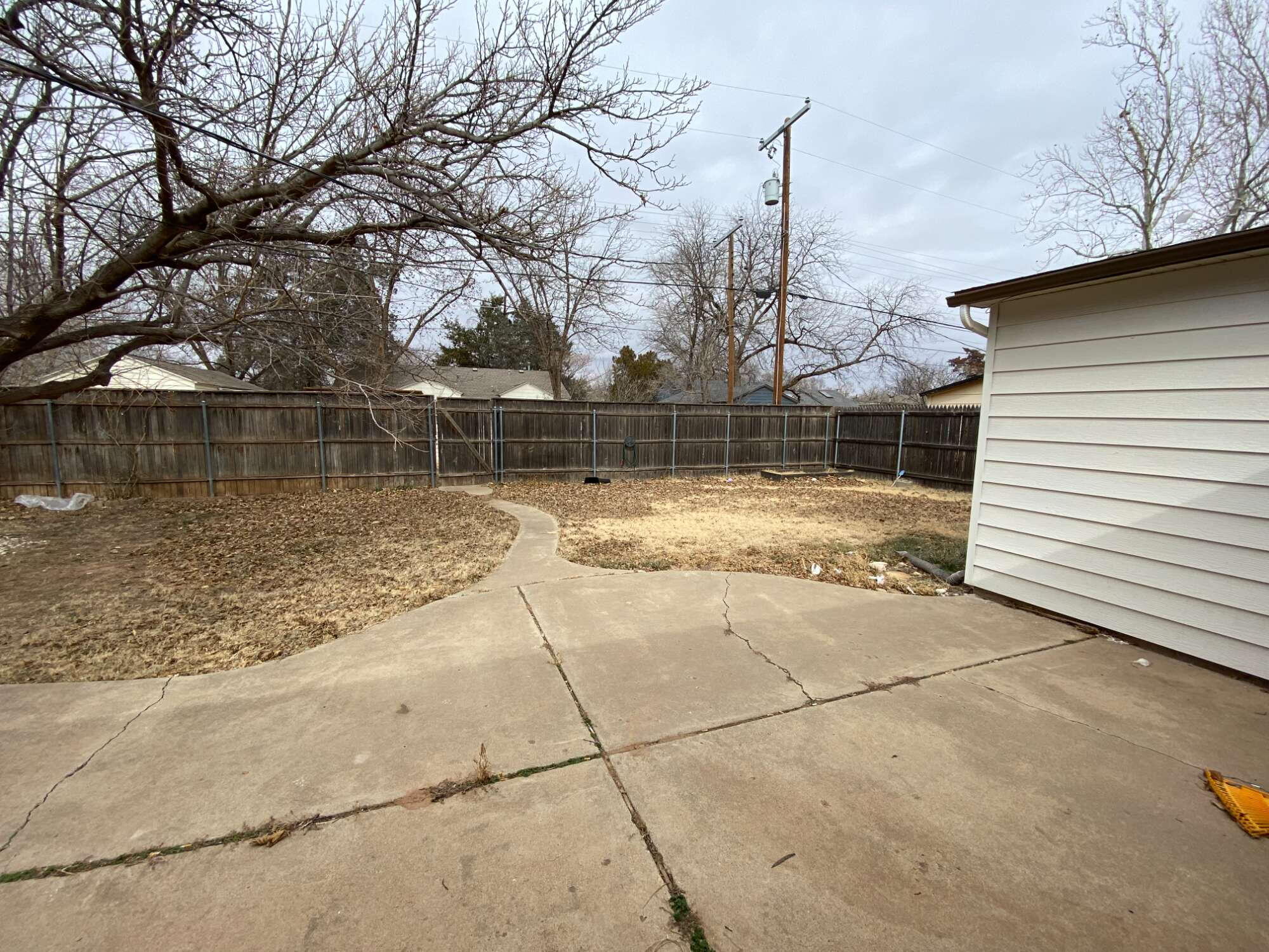3214 32nd Street Lubbock, TX 79410 - Photo 16 of 17 a backyard of a house with lots of green space