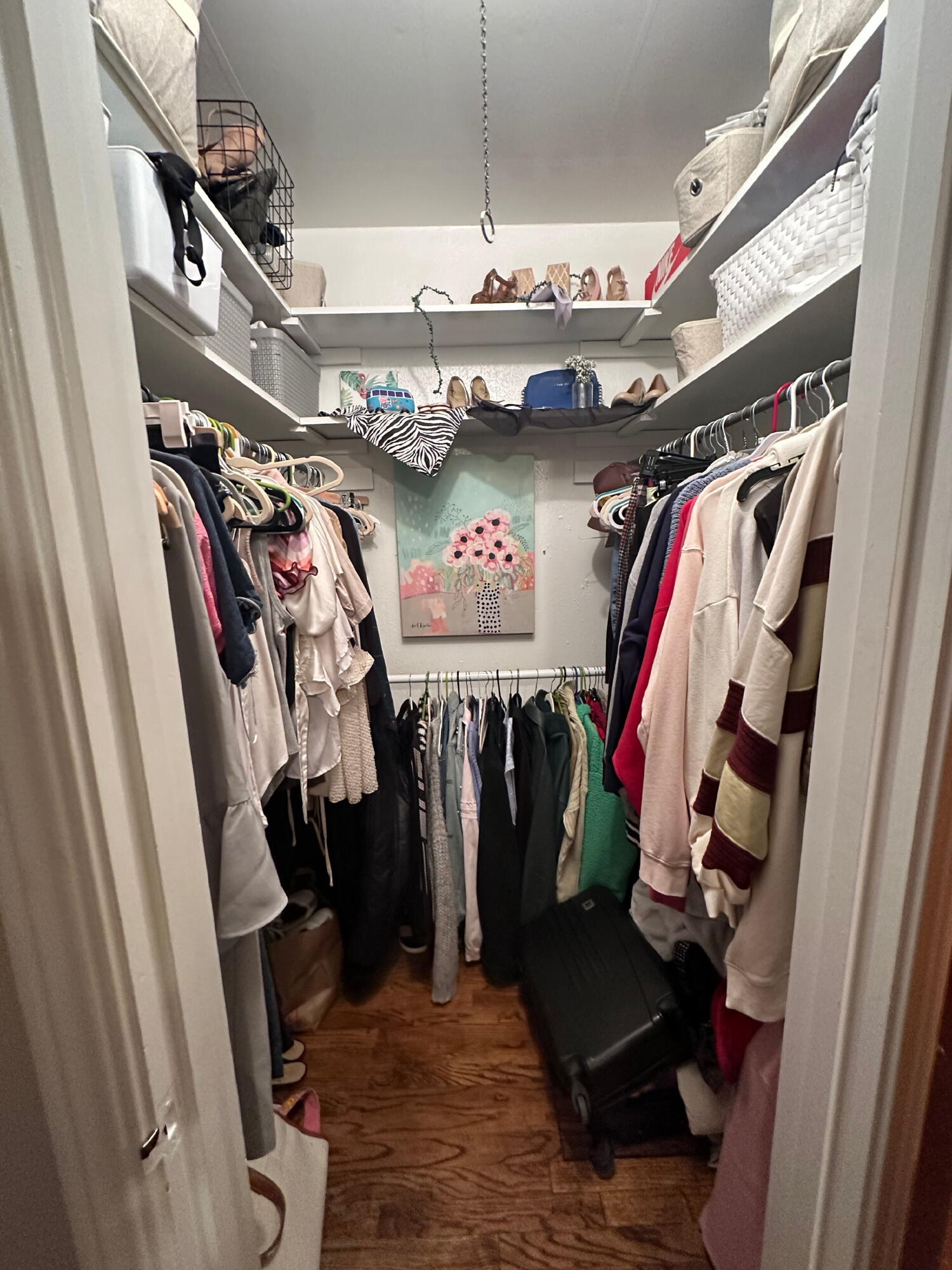 3214 32nd Street Lubbock, TX 79410 - Photo 10 of 17 a view of walk in closet with clothes and shoes
