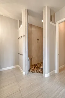 a view of a bathroom with a sink and a shower