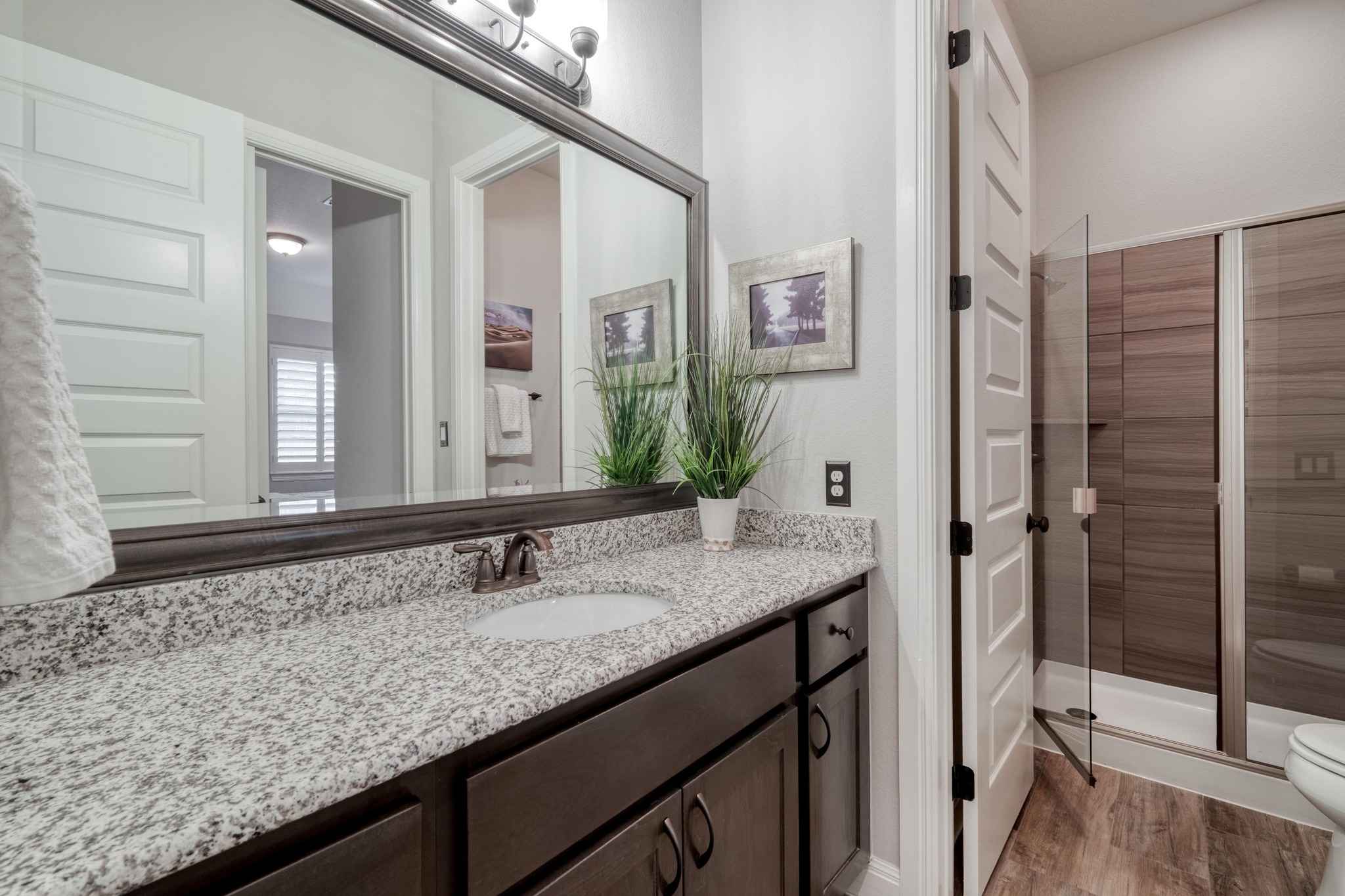 3836 Kyler Glen Road Round Rock, TX 78681 - Photo 33 of 38 a bathroom with a granite countertop sink and a mirror