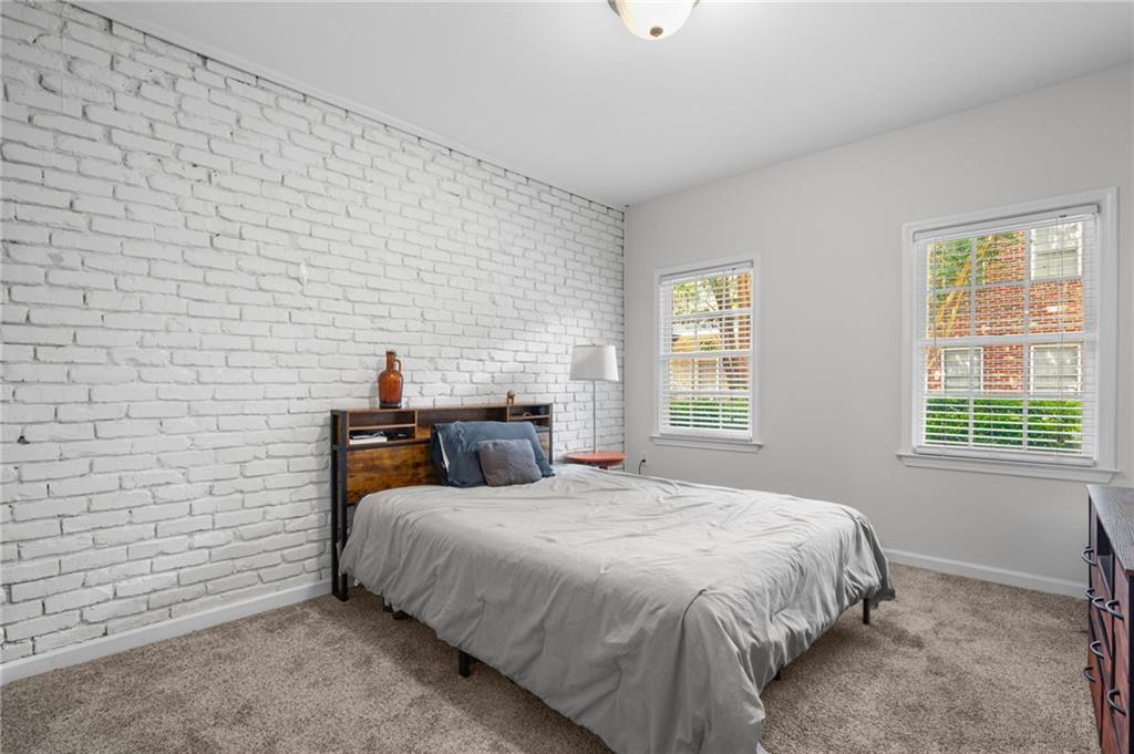 3675 Peachtree Road Northeast, Unit 45 Atlanta, GA 30319 - Photo 22 of 42 a bedroom with a bed and a window
