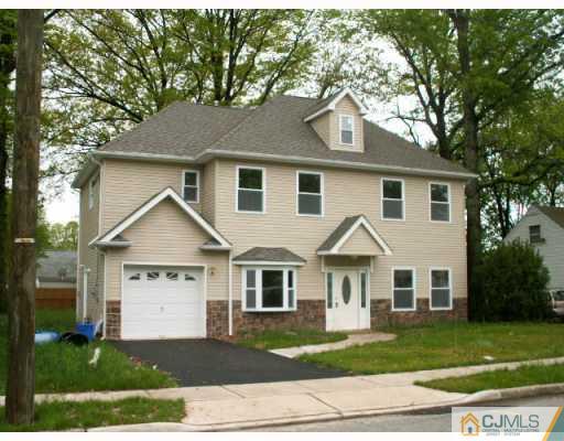 19 Parkerson Road Edison, NJ 08817 - Photo 1 of 7 a front view of a house with a yard