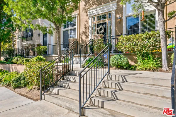 a view of a house with a street