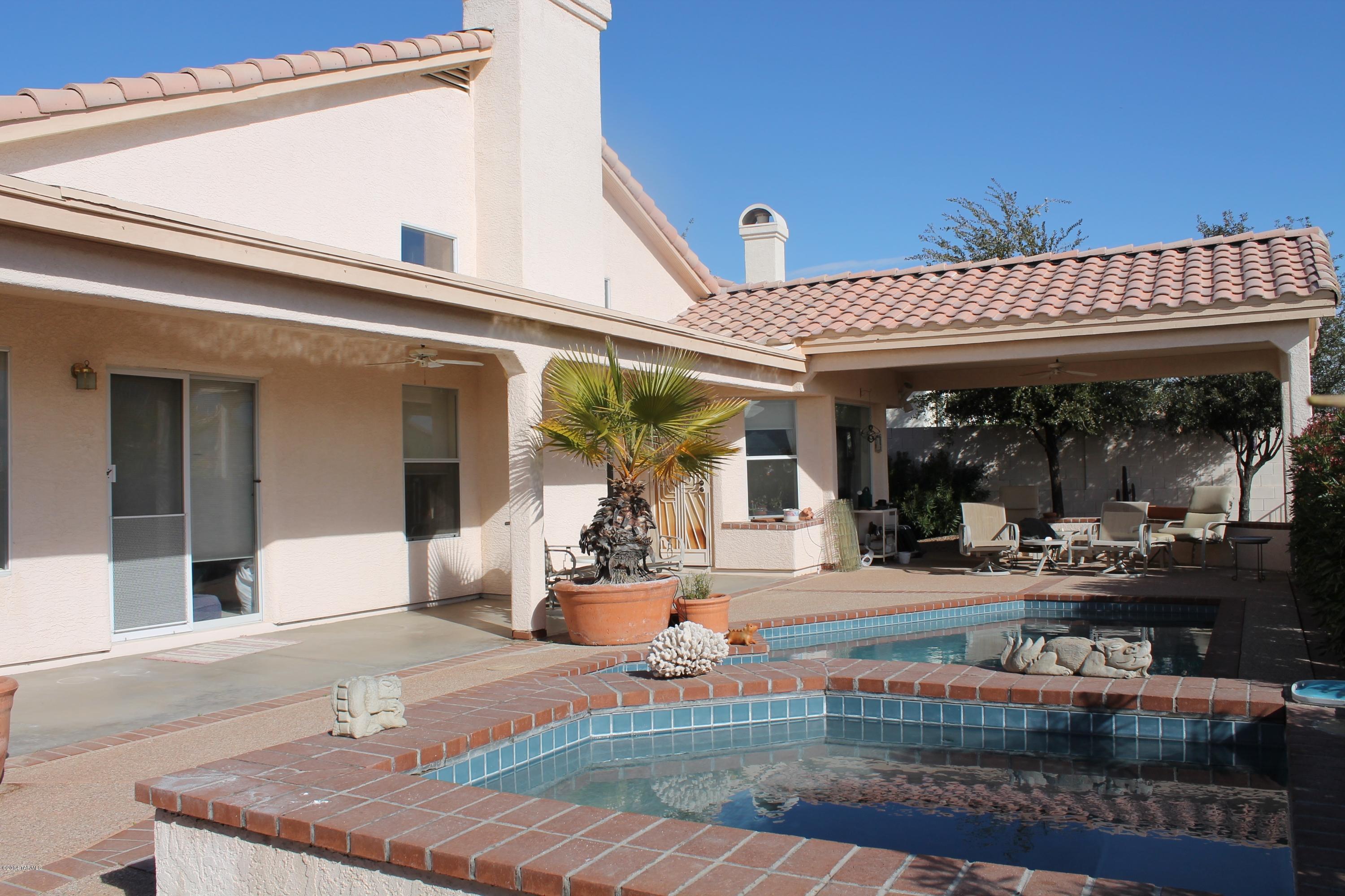 11286 North Copper Spring Trail Tucson, AZ 85737 - Photo 8 of 8 front view of a house with a patio