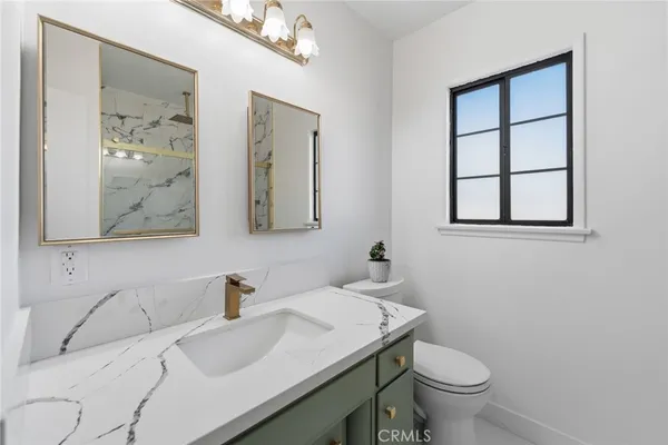 a bathroom with a sink and a toilet