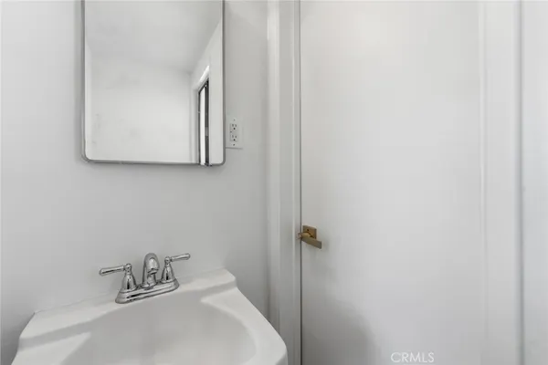 a bathroom with a sink and mirror