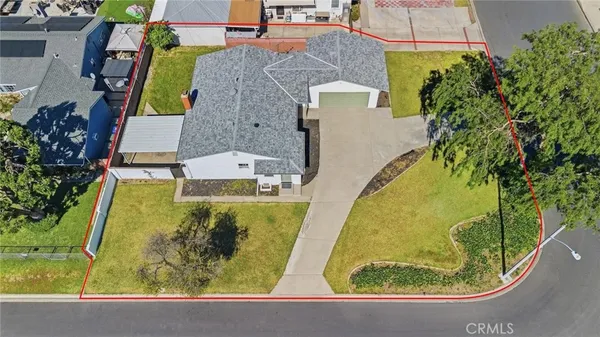 an aerial view of a house with swimming pool