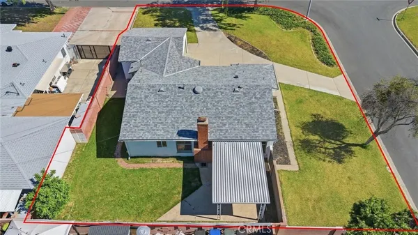 an aerial view of a house with swimming pool