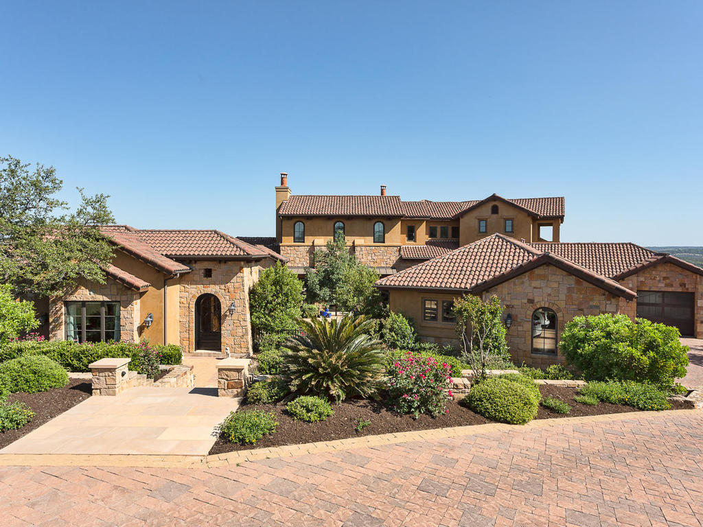 11909 Musket Rim Street Austin, TX 78738 - Photo 1 of 1 a front view of a house with garden