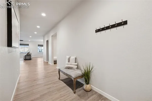 a view of kitchen with furniture and wooden floor
