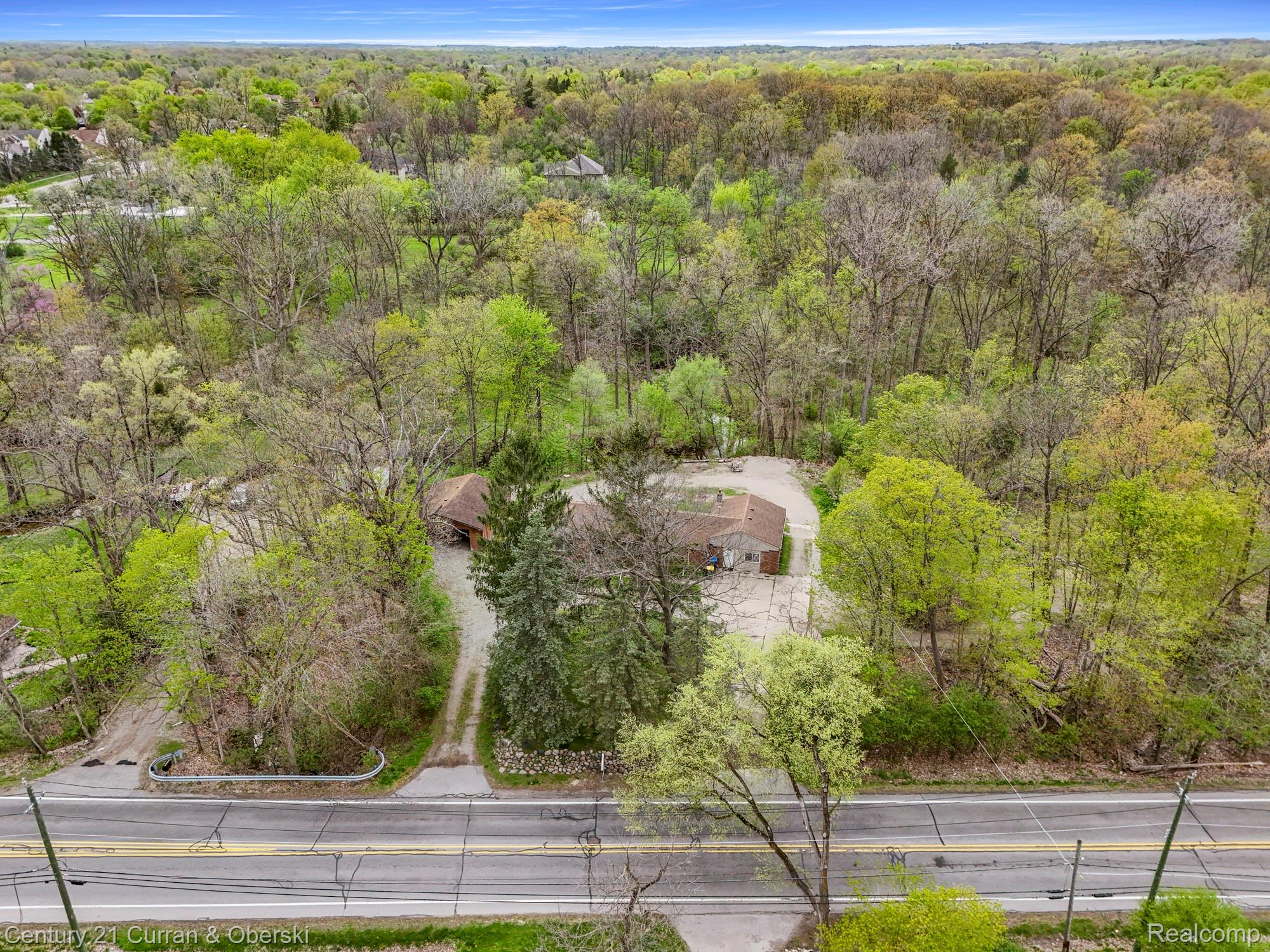 25205 Inkster Road Farmington, MI 48336 - Photo 3 of 46 Drone / aerial view of a forest