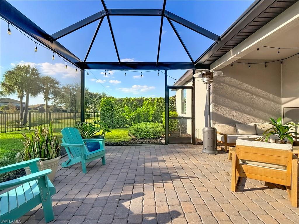 19890 Beverly Park Road Estero, FL 33928 - Photo 26 of 38 View of patio with a lanai and a sunroom