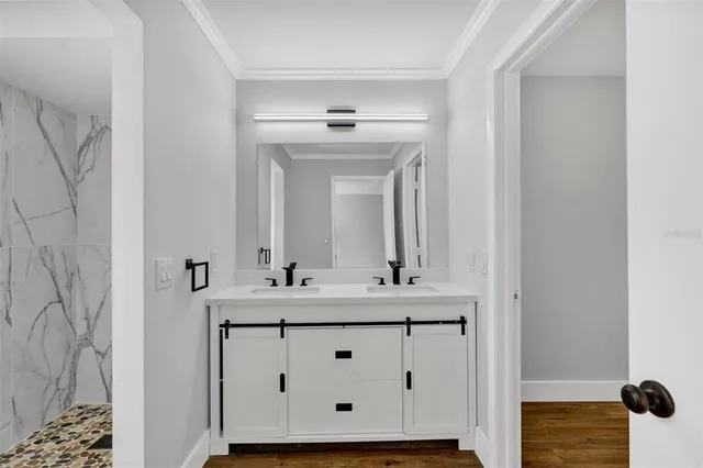 a bathroom with a sink and a mirror