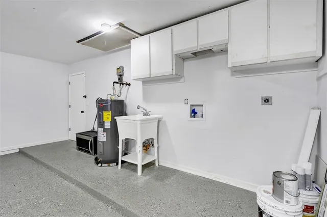 a utility room with cabinets