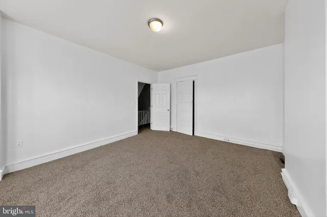 a view of an empty room with windows