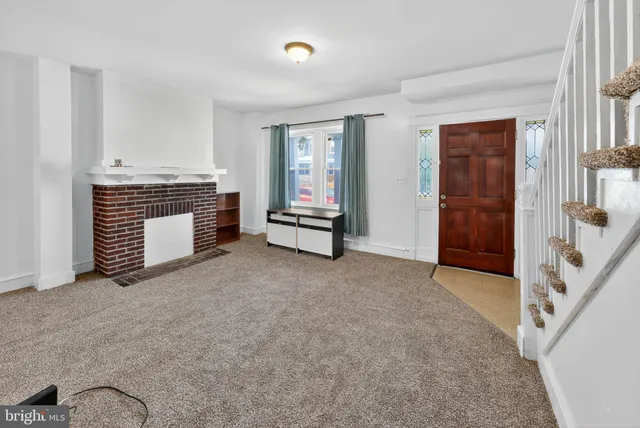 a view of an empty room with windows