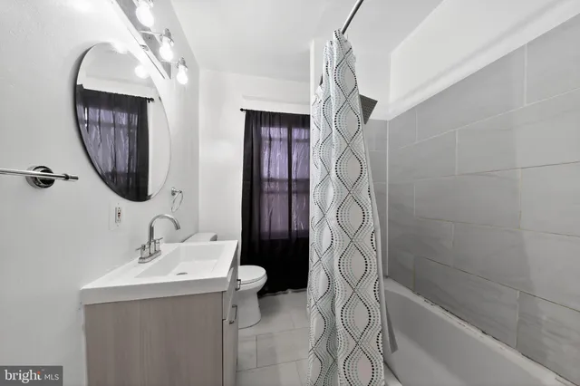 a view of a room with wooden walls