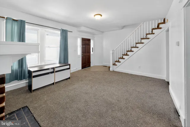 a view of kitchen and refrigerator