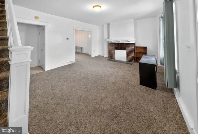 a view of livingroom with furniture and window