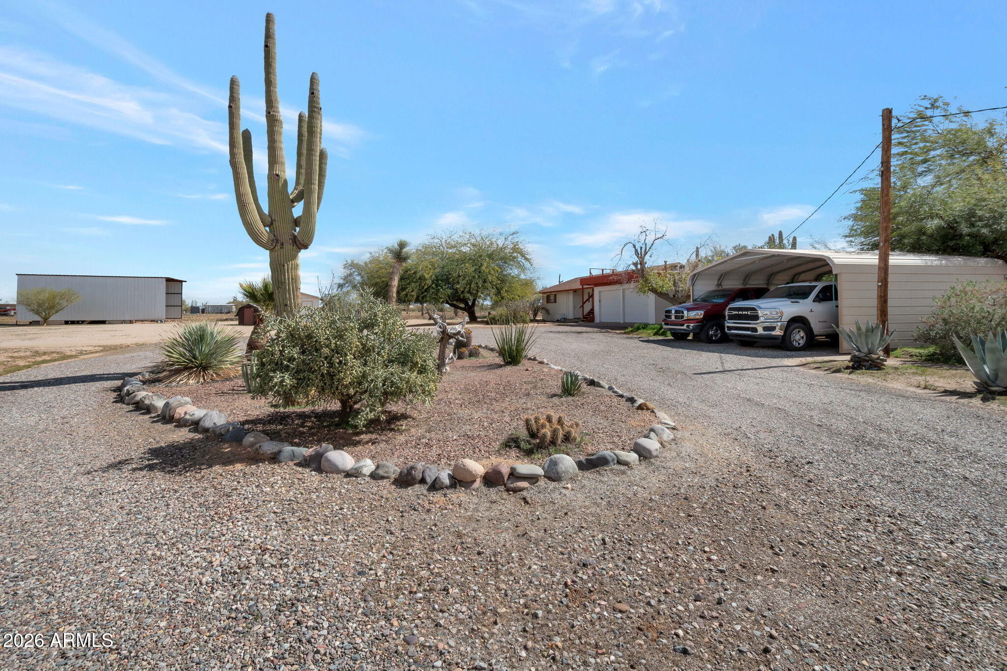 8865 North Page Road Florence, AZ 85132 - Photo 14 of 15 a view of a yard with car parked