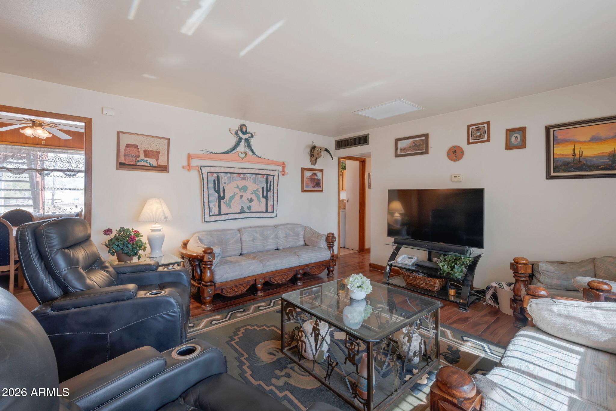 8865 North Page Road Florence, AZ 85132 - Photo 4 of 15 a living room with furniture and a flat screen tv