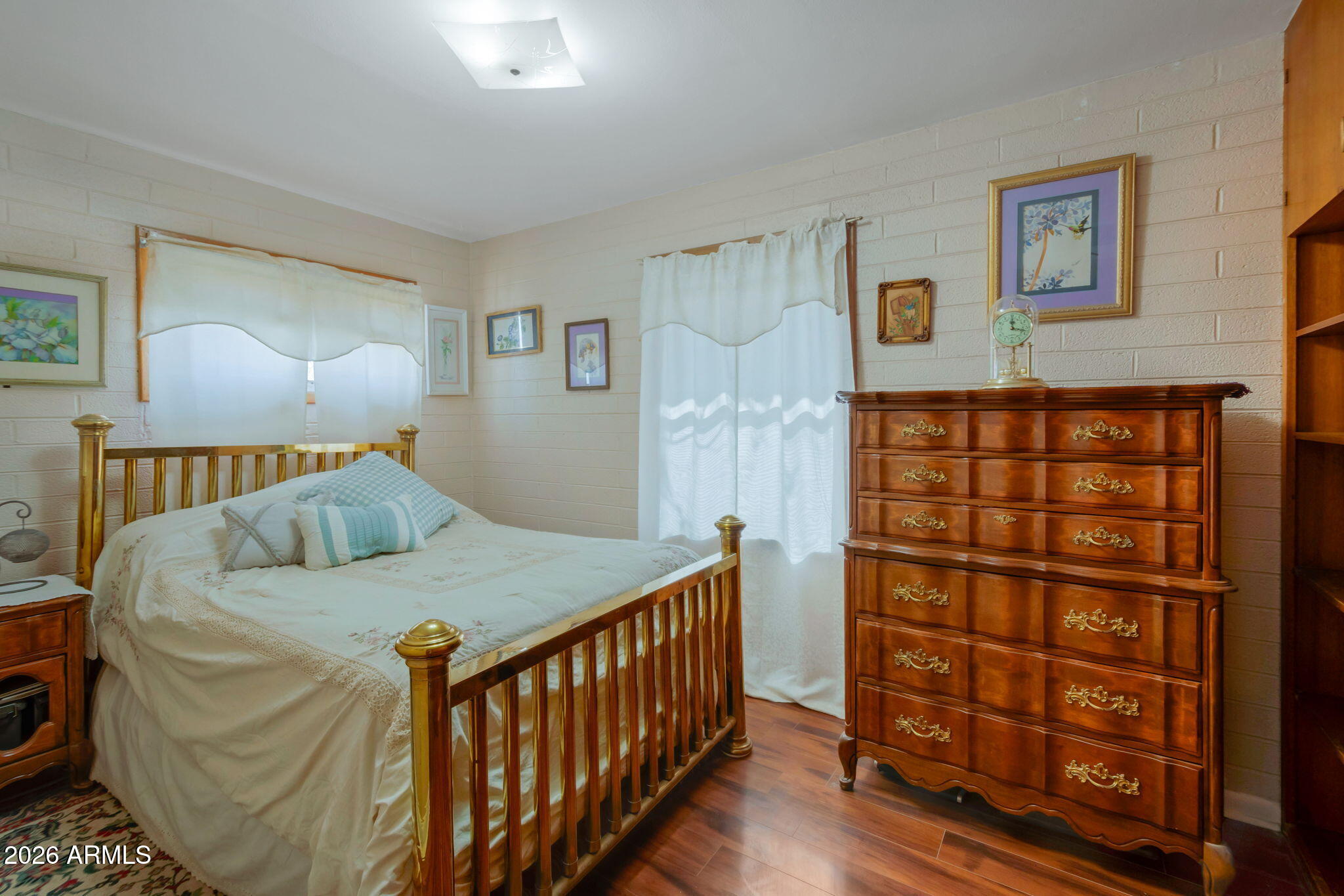 8865 North Page Road Florence, AZ 85132 - Photo 9 of 15 a bedroom with a bed with wooden floor