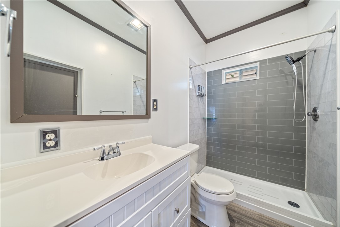 1205 10th Street Corpus Christi, TX 78404 - Photo 14 of 38 a bathroom with a sink a toilet and shower