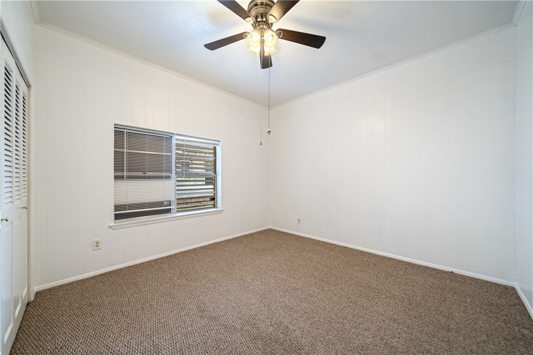 1205 10th Street Corpus Christi, TX 78404 - Photo 20 of 38 a view of an empty room with a window