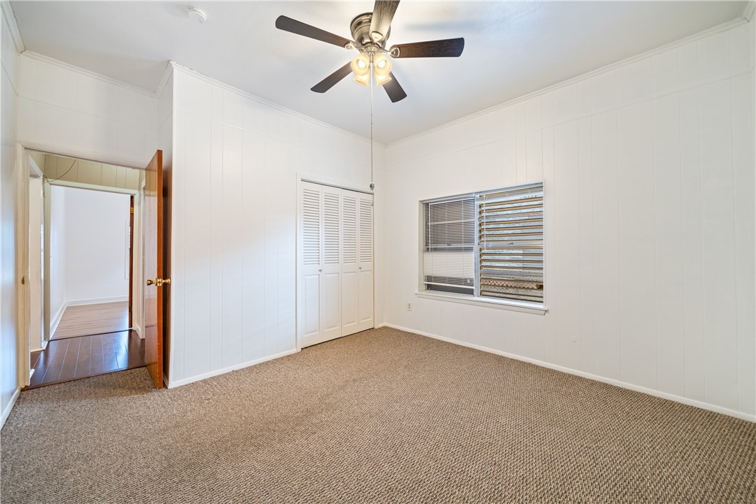 1205 10th Street Corpus Christi, TX 78404 - Photo 21 of 38 a view of a livingroom with a ceiling fan and window