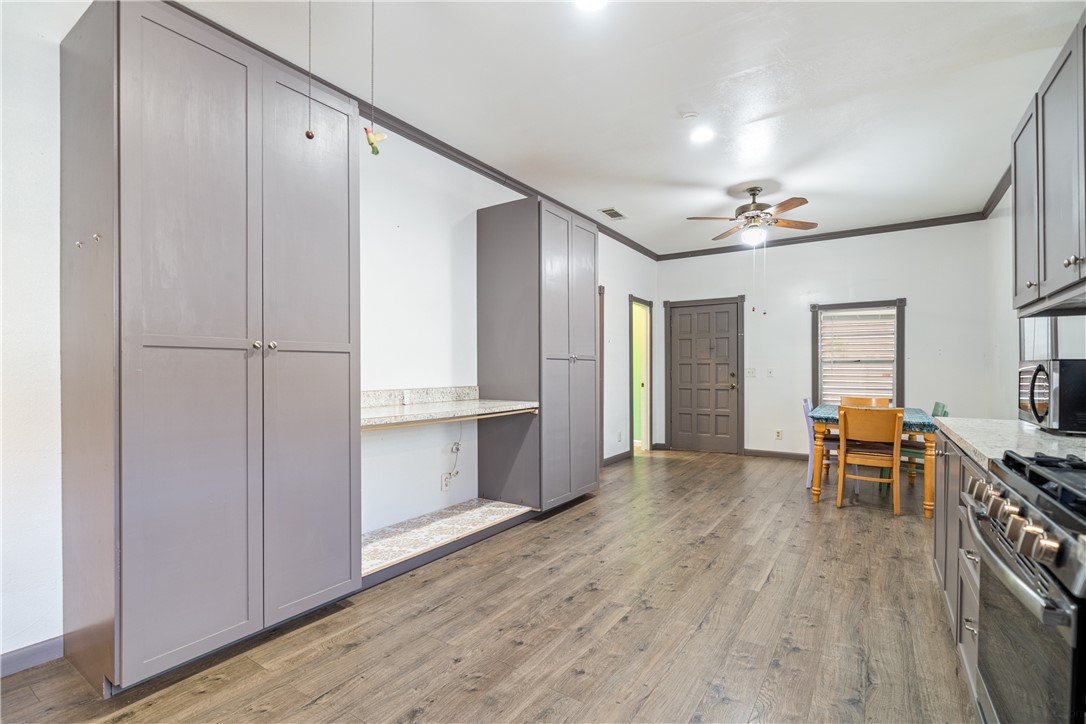 1205 10th Street Corpus Christi, TX 78404 - Photo 24 of 38 a view of kitchen with furniture and wooden floor