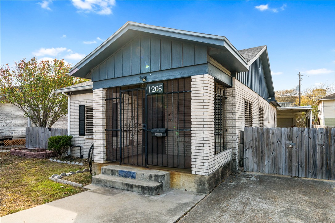 1205 10th Street Corpus Christi, TX 78404 - Photo 5 of 38 a view of a house with wooden walls